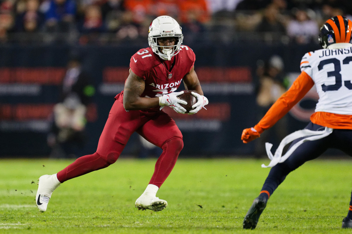 Dec 24, 2023; Chicago, Illinois, USA; Arizona Cardinals running back Emari Demercado (31) runs with the ball against the Chicago Bears at Soldier Field. Mandatory Credit: Jamie Sabau-USA TODAY Sports  